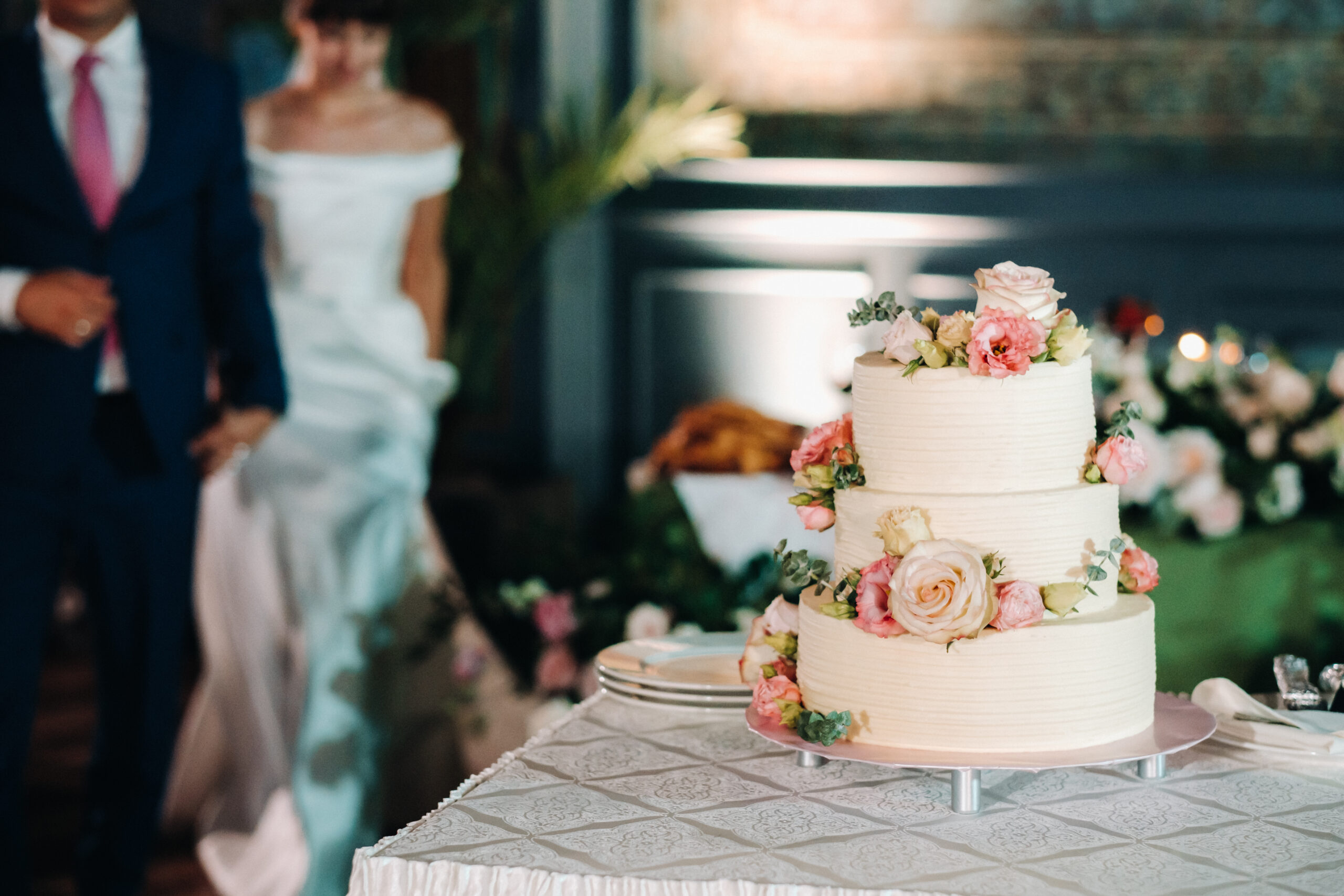 Elegant wedding cake at the wedding in three tiers